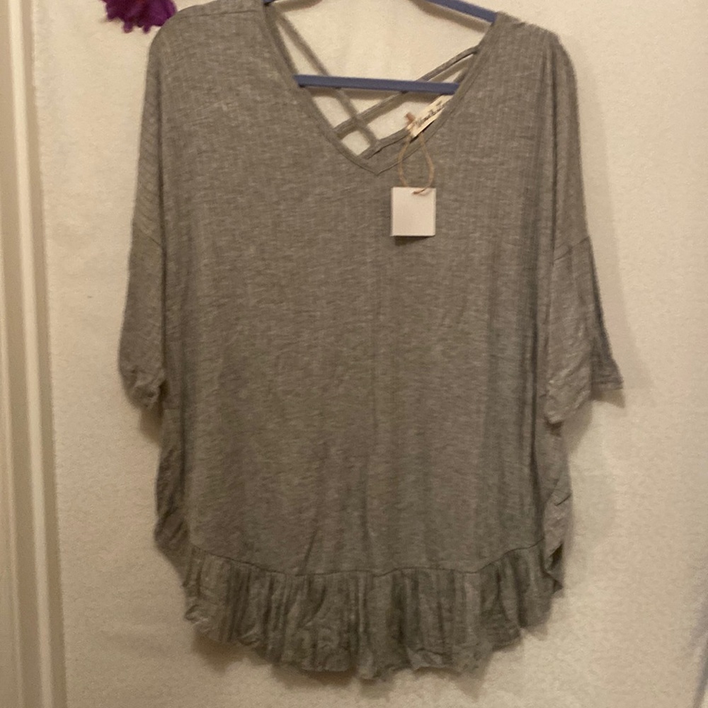 Lightweight summer blouse with crisscross design in back.